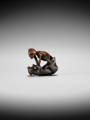 Lot 347 - A FINE WOOD NETSUKE OF A WOLF AND SKELETON, ATTRIBUTED TO SHOKO