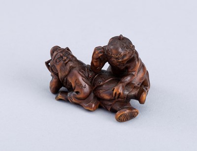 Lot 888 - KOGYOKU: A WOOD NETSUKE OF SHOKI AND ONI, MEIJI