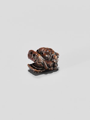 Lot 433 - A WOOD NETSUKE OF A SHISHI MASK WITH MOVABLE JAW