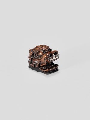 Lot 433 - A WOOD NETSUKE OF A SHISHI MASK WITH MOVABLE JAW