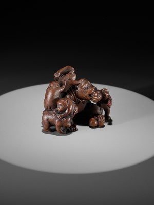 Lot 261 - UNHODO MASAYOSHI: A SUPERB WOOD OKIMONO OF A GROUP OF MONKEYS AND DOG