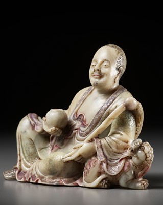 A BAIFURONG SOAPSTONE FIGURE OF XIAOSHI LUOHAN WITH A BUDDHIST LION, EARLY QING DYNASTY