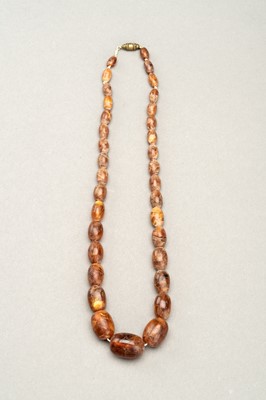 Lot 224 - A HIMALAYAN NECKLACE WITH THIRTY-FOUR AMBER BEADS