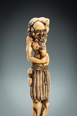 Lot 391 - A TALL IVORY NETSUKE OF ASHINAGA WITH A CANDLE