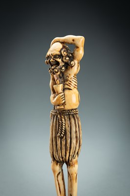 Lot 391 - A TALL IVORY NETSUKE OF ASHINAGA WITH A CANDLE