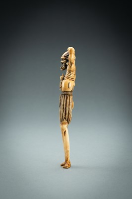 Lot 391 - A TALL IVORY NETSUKE OF ASHINAGA WITH A CANDLE