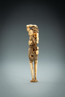 Lot 391 - A TALL IVORY NETSUKE OF ASHINAGA WITH A CANDLE