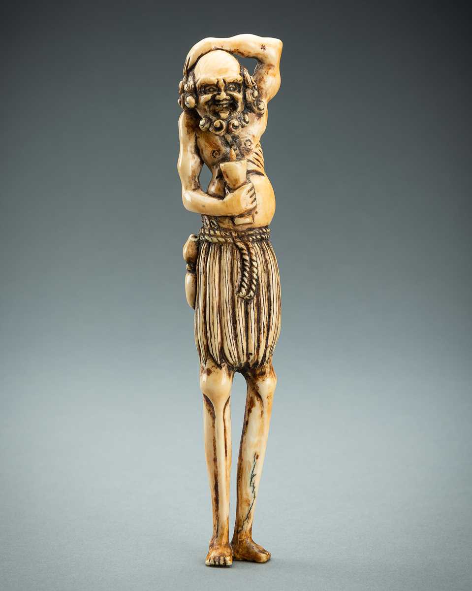 Lot 391 - A TALL IVORY NETSUKE OF ASHINAGA WITH A CANDLE