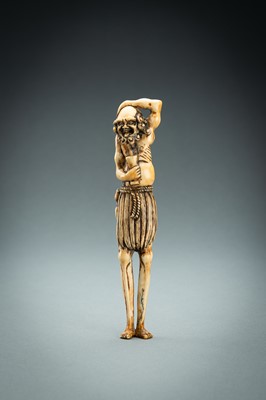 Lot 391 - A TALL IVORY NETSUKE OF ASHINAGA WITH A CANDLE