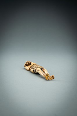 Lot 391 - A TALL IVORY NETSUKE OF ASHINAGA WITH A CANDLE