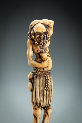 Lot 391 - A TALL IVORY NETSUKE OF ASHINAGA WITH A CANDLE