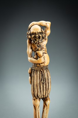 Lot 391 - A TALL IVORY NETSUKE OF ASHINAGA WITH A CANDLE