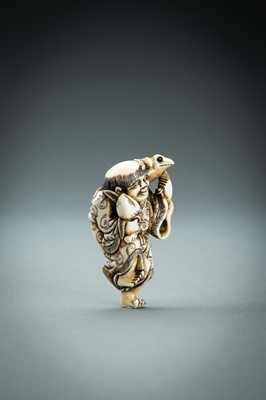 Lot 414 - YOSHINAGA: AN IVORY NETSUKE OF GAMA SENNIN, EDO PERIOD