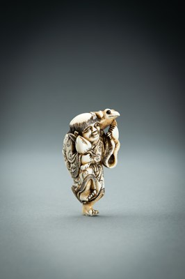Lot 414 - YOSHINAGA: AN IVORY NETSUKE OF GAMA SENNIN, EDO PERIOD