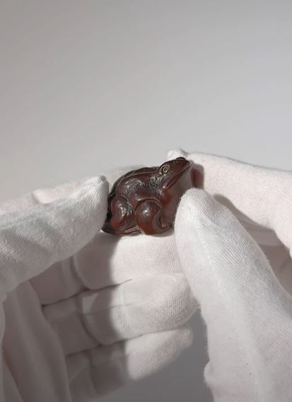 Lot 132 - MINKO: A DARK WOOD NETSUKE OF A FAT TOAD