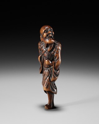 Lot 603 - AN OLD WOOD NETSUKE OF TEKKAI SENNIN