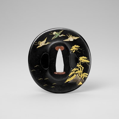 Lot 441 - TENKODO HIDEKUNI: A FINE ENAMELLED SHAKUDO TSUBA WITH CRANES AND PINE