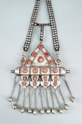 Lot 745 - A TURKOMAN SILVER AND CARNELIAN AMULET HOLDER, c. 1900s