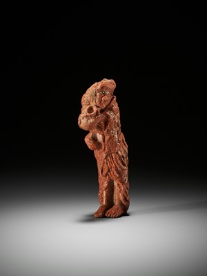 Lot 300 - AN EXCEPTIONALLY RARE AND LARGE SOLID CORAL NETSUKE OF GAMA SENNIN