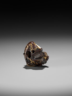 Lot 272 - A RARE AND UNUSUAL INLAID AND LACQUERED WOOD NETSUKE OF DAIKOKU