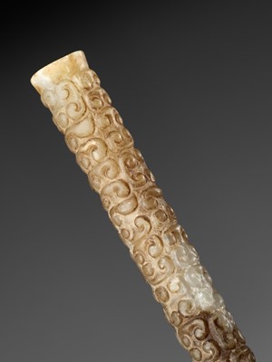 Lot 1039 - A WHITE JADE ‘DRAGON’ CYLINDRICAL BEAD, LATE SPRING AND AUTUMN PERIOD