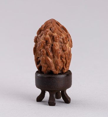 Lot 757 - A CARVED WALNUT WITH IMMORTALS, QING DYNASTY