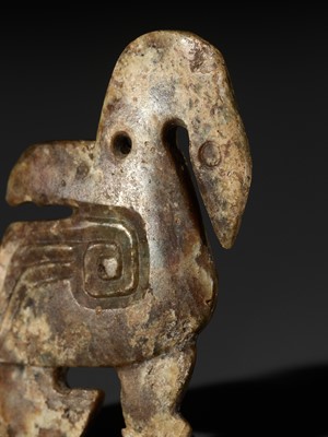 Lot 1027 - A 'TWO-FACE' JADE PENDANT DEPICTING A MYTHICAL WATERBIRD, LATE SHANG TO WESTERN ZHOU DYNASTY