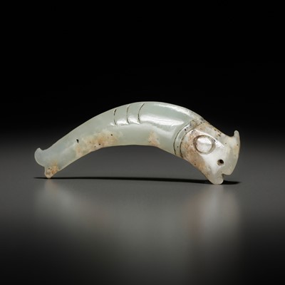 Lot 1016 - A PALE CELADON ‘FISH’ PENDANT, LATE SHANG TO EARLY WESTERN ZHOU DYNASTY