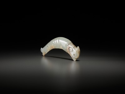 Lot 52 - A PALE CELADON ‘FISH’ PENDANT, LATE SHANG TO EARLY WESTERN ZHOU DYNASTY