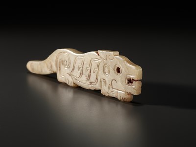 Lot 54 - A YELLOW JADE ‘TIGER’ PENDANT, LATE SHANG TO WESTERN ZHOU DYNASTY