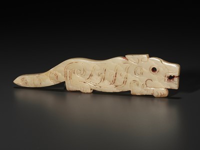 Lot 1023 - A YELLOW JADE ‘TIGER’ PENDANT, LATE SHANG TO WESTERN ZHOU DYNASTY