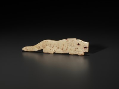 Lot 1023 - A YELLOW JADE ‘TIGER’ PENDANT, LATE SHANG TO WESTERN ZHOU DYNASTY