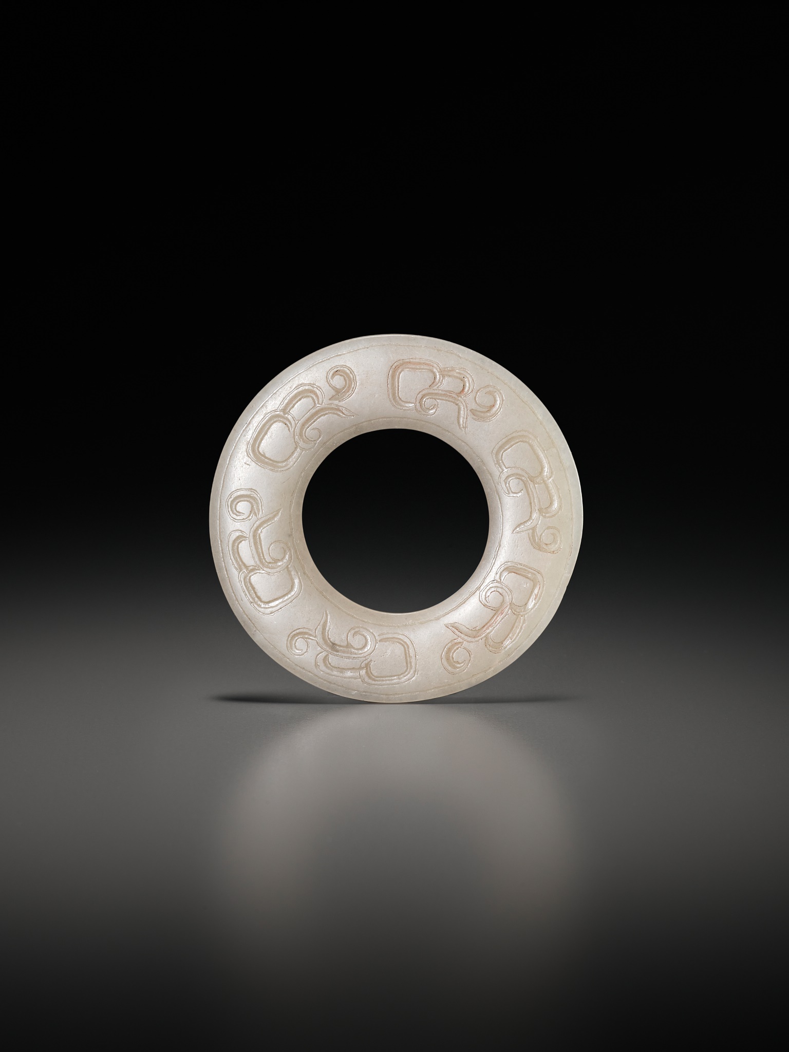 Lot 64 - A JADE RING, HUAN, EASTERN ZHOU DYNASTY