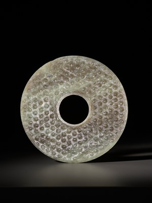 Lot 1041 - A CELADON AND BROWN JADE BI DISK, EASTERN ZHOU TO WARRING STATES PERIOD