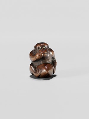 Lot 344 - A WOOD NETSUKE OF A MONKEY EATING A PEACH, ATTRIBUTED TO MIWA