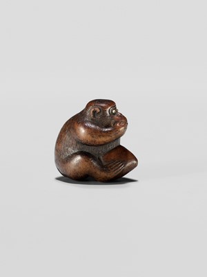 Lot 344 - A WOOD NETSUKE OF A MONKEY EATING A PEACH, ATTRIBUTED TO MIWA