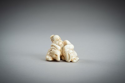 Lot 876 - AN IVORY NETSUKE OF A SAGE RECLINING ON A GOAT, EDO PERIOD