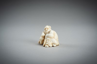 Lot 876 - AN IVORY NETSUKE OF A SAGE RECLINING ON A GOAT, EDO PERIOD