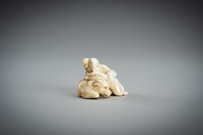 Lot 876 - AN IVORY NETSUKE OF A SAGE RECLINING ON A GOAT, EDO PERIOD