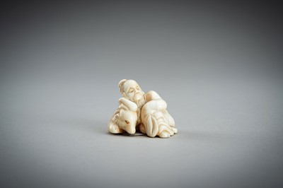 Lot 876 - AN IVORY NETSUKE OF A SAGE RECLINING ON A GOAT, EDO PERIOD