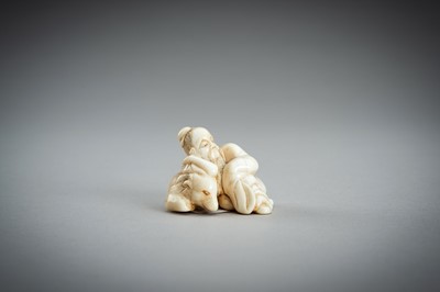 Lot 876 - AN IVORY NETSUKE OF A SAGE RECLINING ON A GOAT, EDO PERIOD