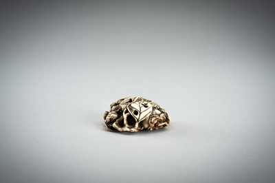 Lot 736 - AN IVORY MANJU NETSUKE WITH FROG ON LOTUS AND PERSIMMONS, 19th CENTURY