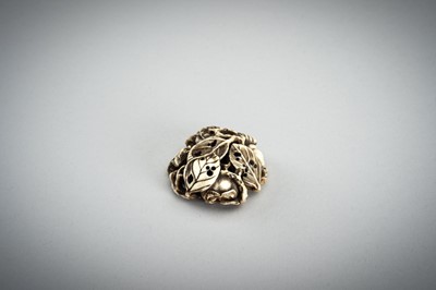 Lot 736 - AN IVORY MANJU NETSUKE WITH FROG ON LOTUS AND PERSIMMONS, 19th CENTURY