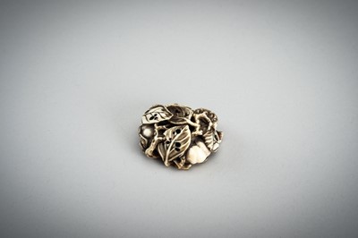 Lot 736 - AN IVORY MANJU NETSUKE WITH FROG ON LOTUS AND PERSIMMONS, 19th CENTURY