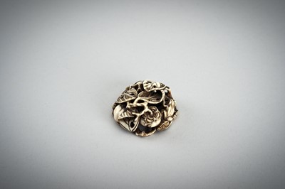 Lot 736 - AN IVORY MANJU NETSUKE WITH FROG ON LOTUS AND PERSIMMONS, 19th CENTURY