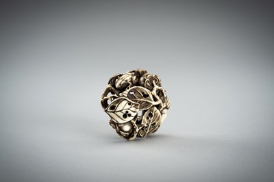 Lot 736 - AN IVORY MANJU NETSUKE WITH FROG ON LOTUS AND PERSIMMONS, 19th CENTURY
