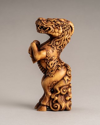 Lot 919 - VASILY PATOKIN: A WOOD OKIMONO OF A KIRIN