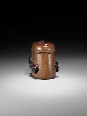 Lot 438 - MINKO: AN INLAID WOOD TONKOTSU WITH NOH AND KYOGEN MASKS
