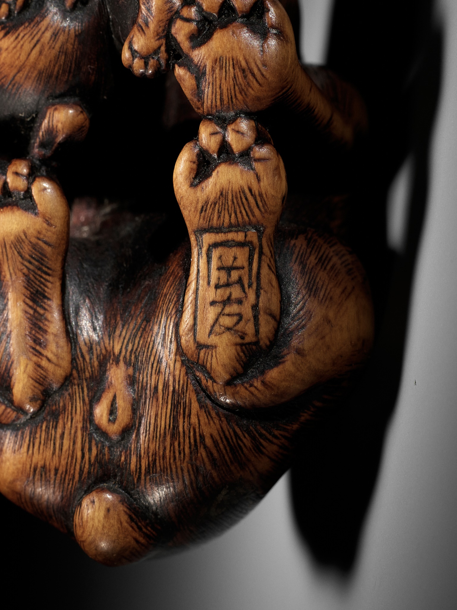 Lot 35 - YAMAGUCHI OKATOMO: A SUPERB WOOD NETSUKE OF A
