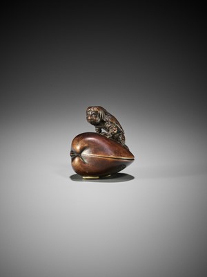 Lot 348 - SUKETADA: A FINE WOOD NETSUKE OF A KAPPA ON HAMAGURI CLAM